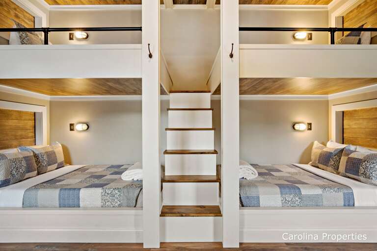 Steps in the middle lead to both the top beds