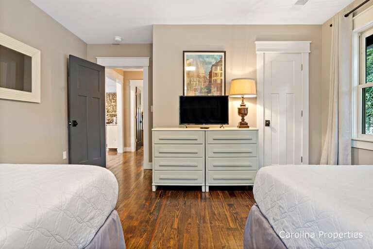 Bedroom 2 has a dresser for your belongings and a small TV