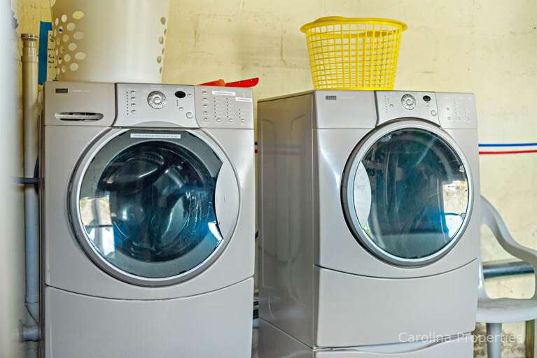 Washer and dryer located int he lower level basement area Washer and dryer located int he lower level basement area