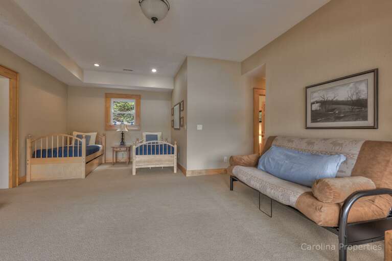 Lower level family room with two twins