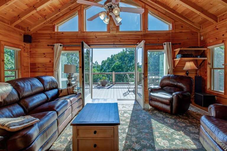 Main level great room opens to spacious wrap around deck Main level great room opens to spacious wrap around deck