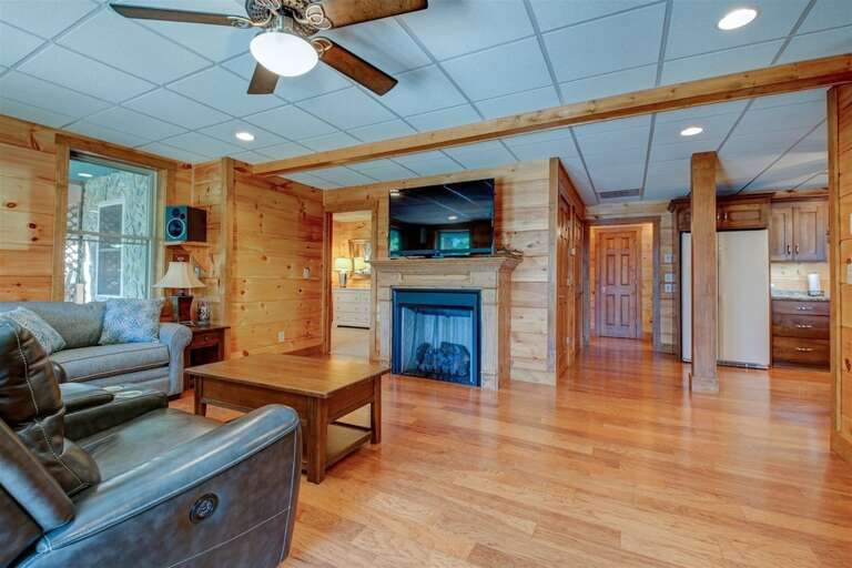 Lower level family room with gas log fireplace and surround sound