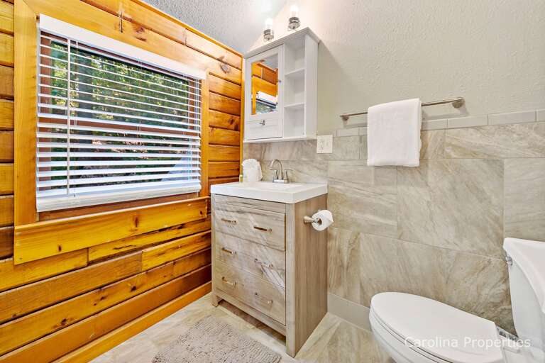 Upstairs full bathroom with combination tub and shower