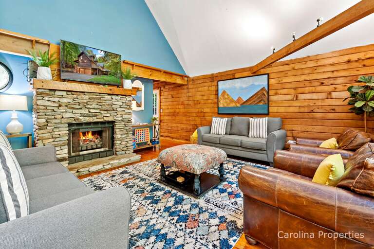 Large flat screen TV above the fireplace