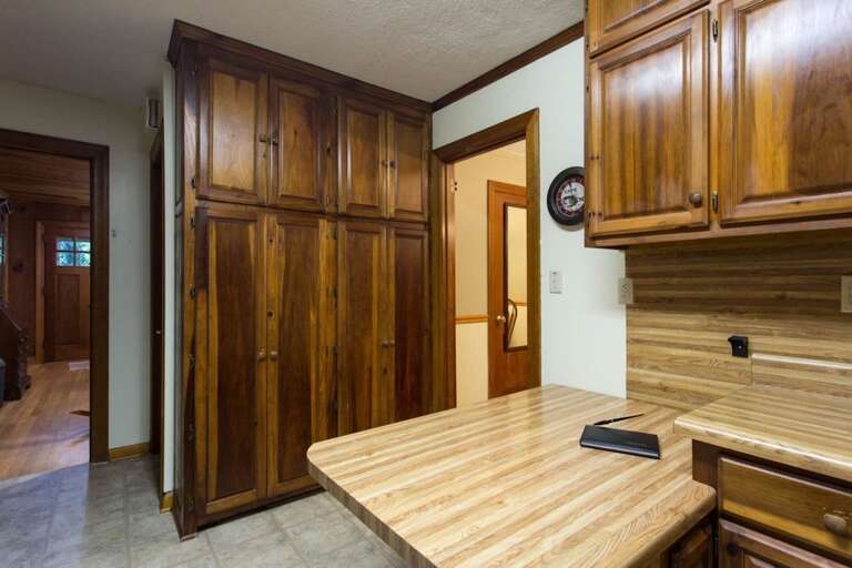 There are cabinets for plenty of food storage. You can see the home`s entry door from this location.
