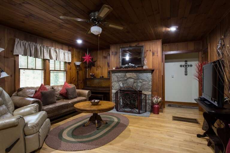 A hall off the living area leads to the two bedrooms and bathroom.  Fireplace has electric logs with a realistic look and feel