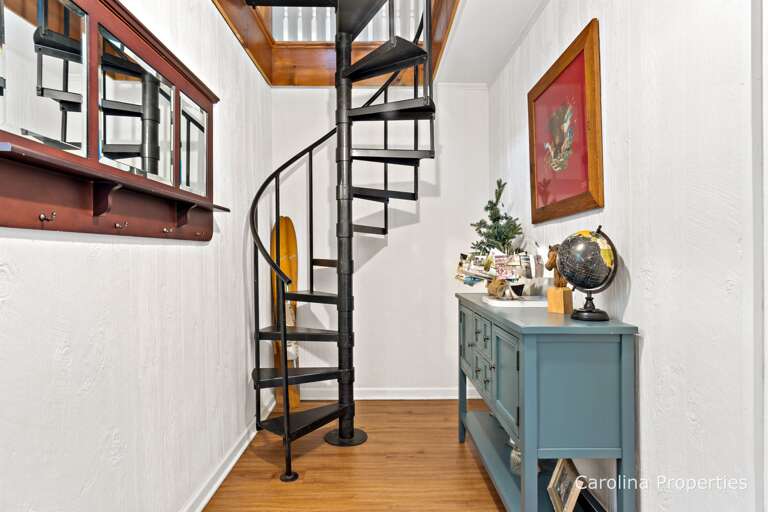Spiral staircase leads up the the bedrooms