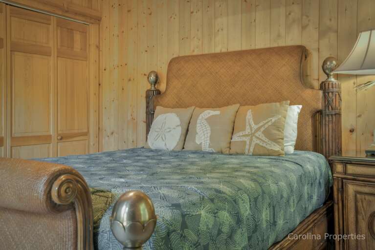 Queen bed in the fourth Bedroom