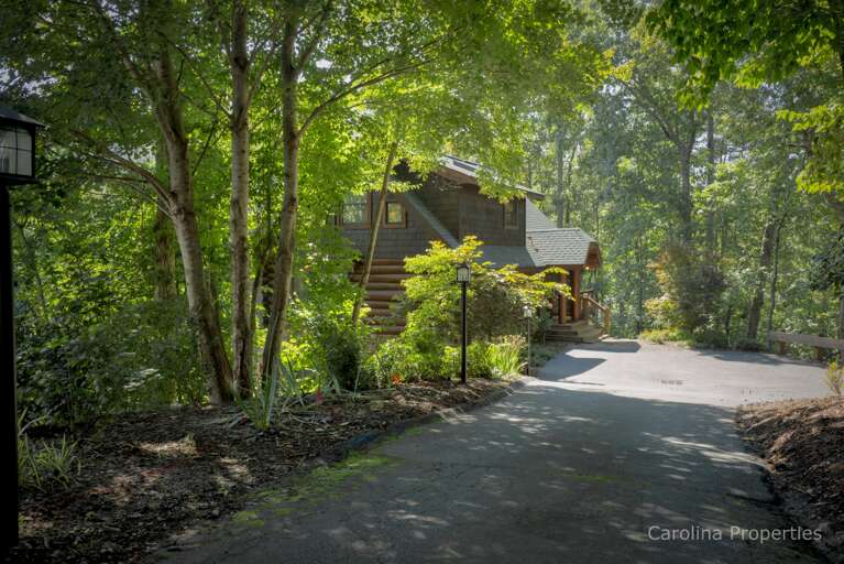 Paved driveway with parking for three vehicles