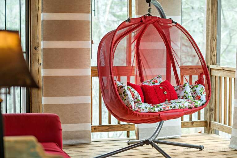 Fun hanging chair in the screened porch Fun hanging chair in the screened porch