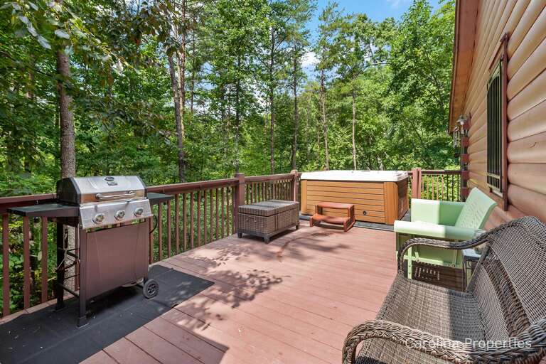 Large open deck with hot tub and grill Large open deck with hot tub and grill