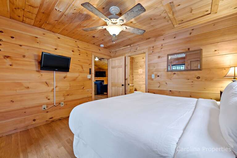 Bedroom 2 features a TV on the wall.