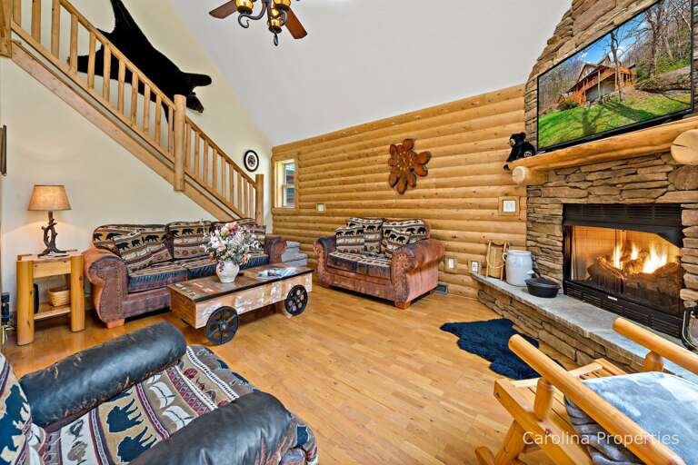 View of the living area with a gas log fireplace View of the living area with a gas log fireplace