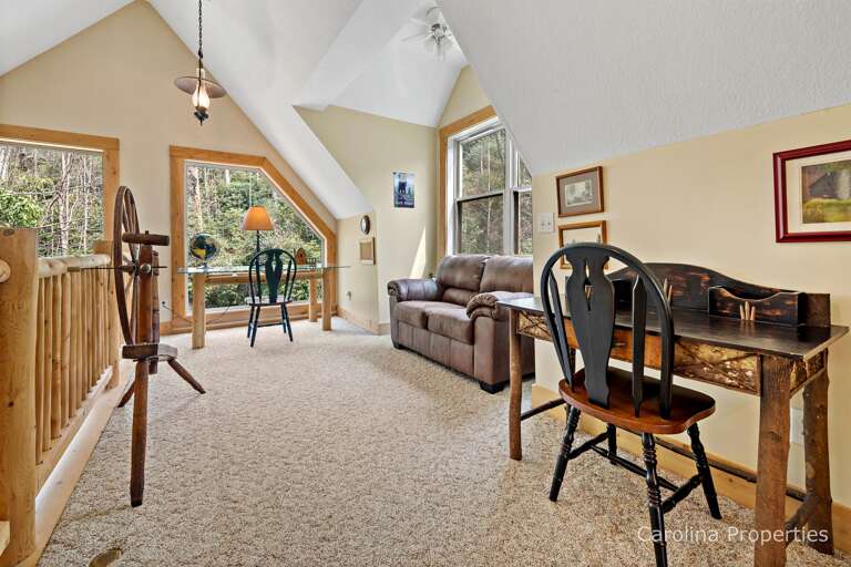 Spacious loft with two work areas and a loveseat Spacious loft with two work areas and a loveseat