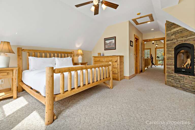 Upper level bedroom with propane fireplace and king size bed Upper level bedroom with propane fireplace and king size bed