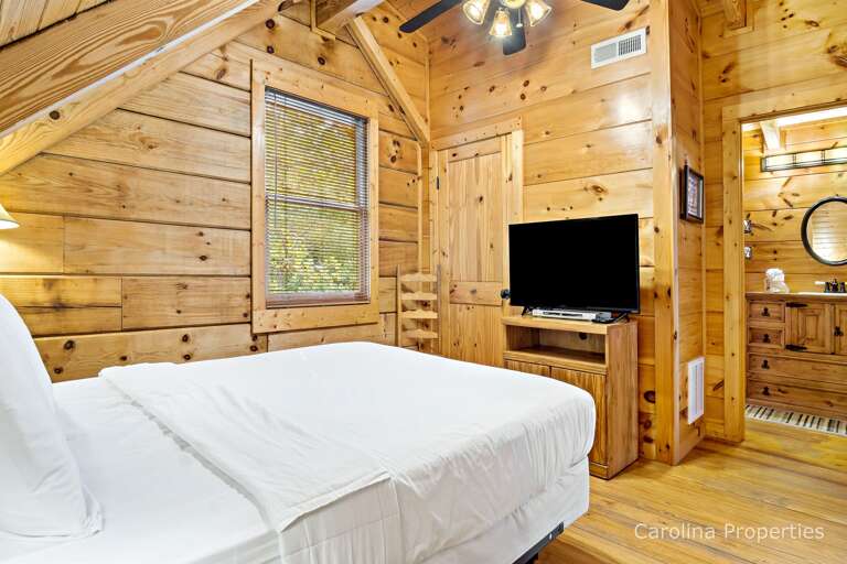 There is a television in the upper level bedroom