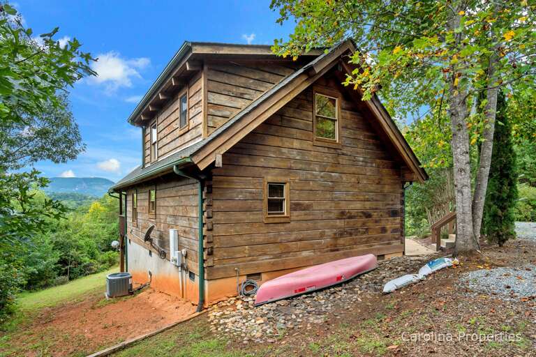 There is a canoe located at the back of the home