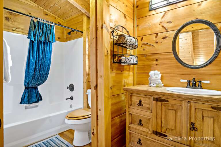 The upstairs bathroom has a shower/tub combo