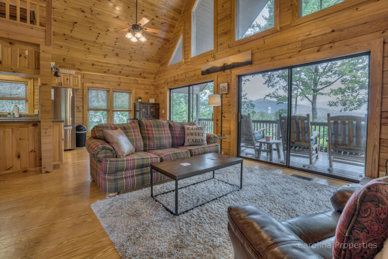 Comfortable seating in the living room with a view of the mountains Comfortable seating in the living room with a view of the mountains