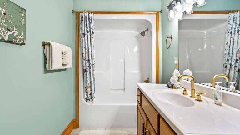 Bathroom 2 has features a shower/tub combo.