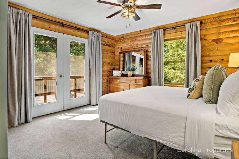 Bedroom 2 offers private balcony access.