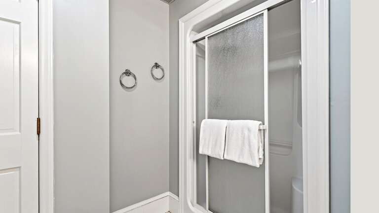 3rd bathroom on the lower level features a standup shower.