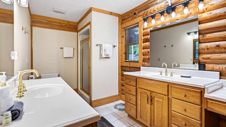 Master bathroom features 2 separate vanities and a shower.