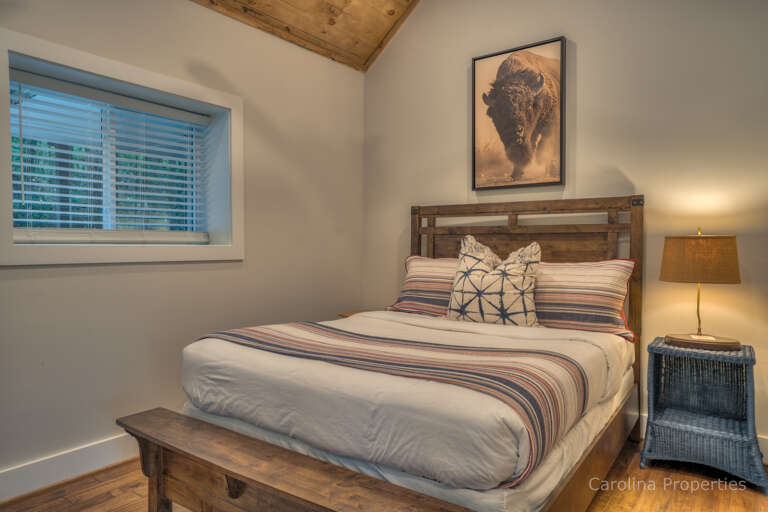 Additional view of bedroom two in the main house with queen size bed