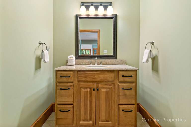 There is a half bath near the family seating area There is a half bath near the family seating area
