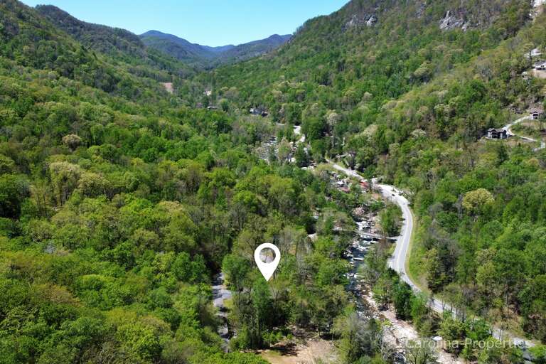 Nestled between the river and the mountains Nestled between the river and the mountains