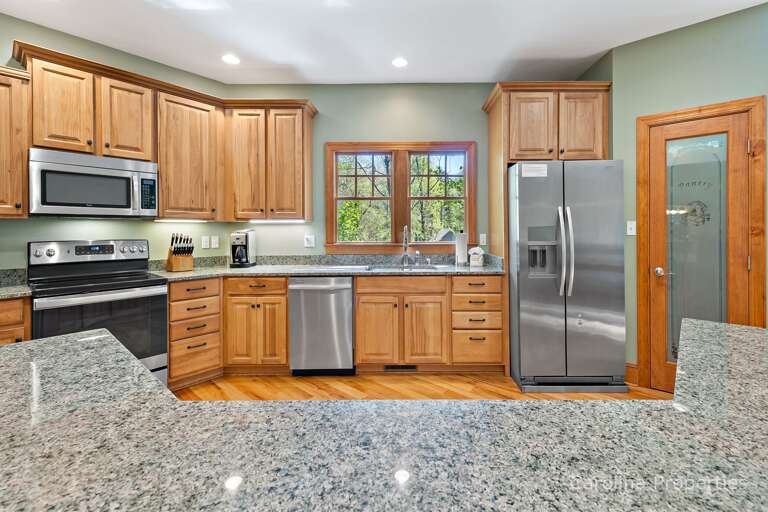 Opposite the dining table is the kitchen and breakfast bar with seating for 5 Opposite the dining table is the kitchen and breakfast bar with seating for 5
