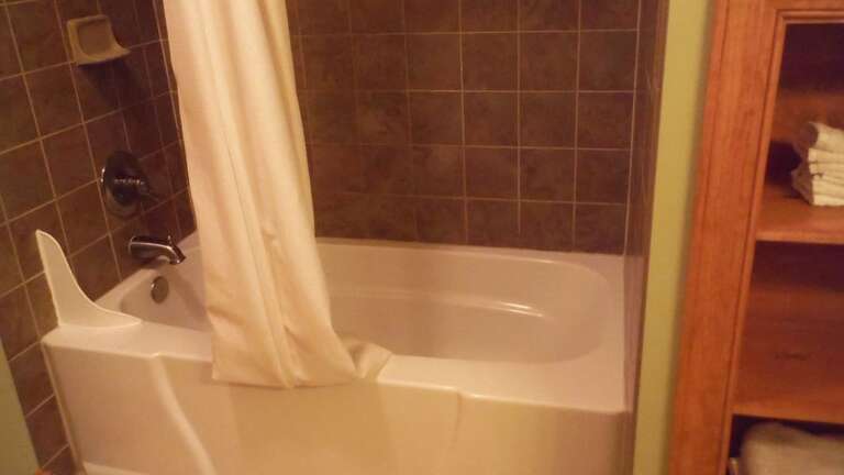 There is also a tiled shower/bathtub combination There is also a tiled shower/bathtub combination