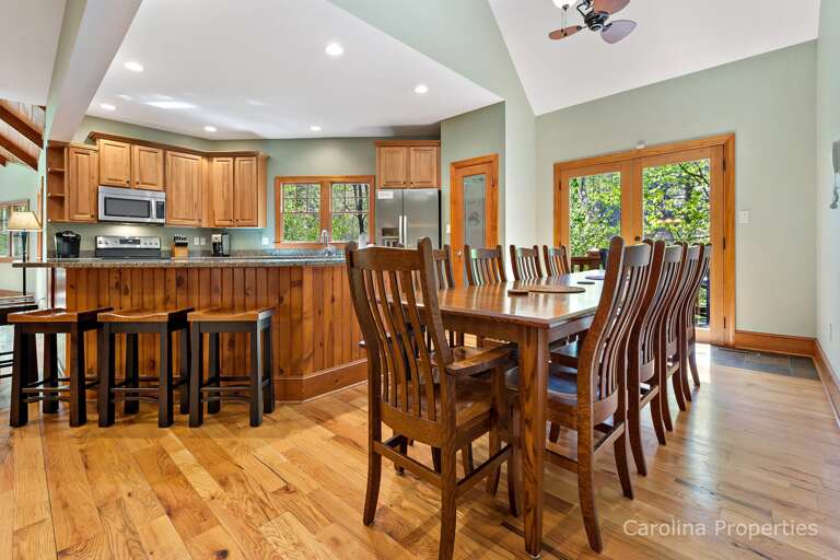 Plenty of seating with 10 chairs at the table and bar stools at the counter close by Plenty of seating with 10 chairs at the table and bar stools at the counter close by