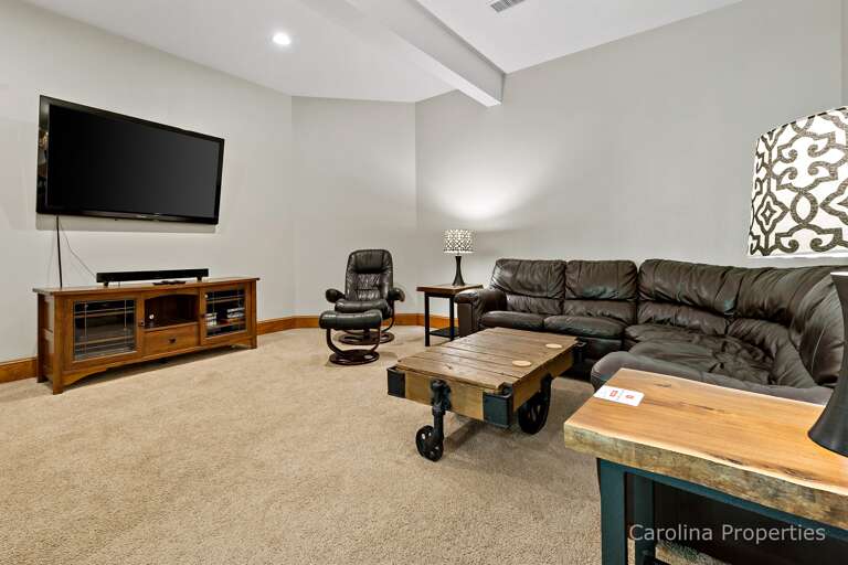 On the lower level is a family room complete with large-screen TV On the lower level is a family room complete with large-screen TV