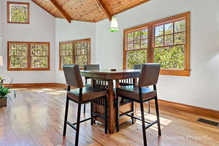 There is a game table in close vicinity of the family seating area There is a game table in close vicinity of the family seating area