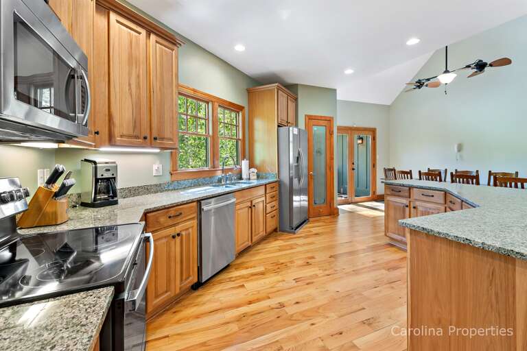 To the right of the side-by-side refrigerator, with in-door ice/water dispenser, is a pantry To the right of the side-by-side refrigerator, with in-door ice/water dispenser, is a pantry
