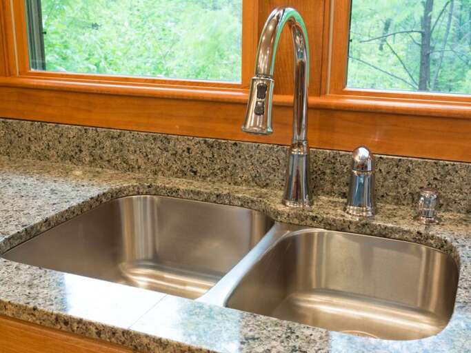 There are high-end finishes and fixtures throughout the home, including the stylish kitchen sink faucet. There are high-end finishes and fixtures throughout the home, including the stylish kitchen sink faucet.