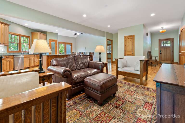 Past the kitchen is a seating area with a bathroom conveniently located near by Past the kitchen is a seating area with a bathroom conveniently located near by