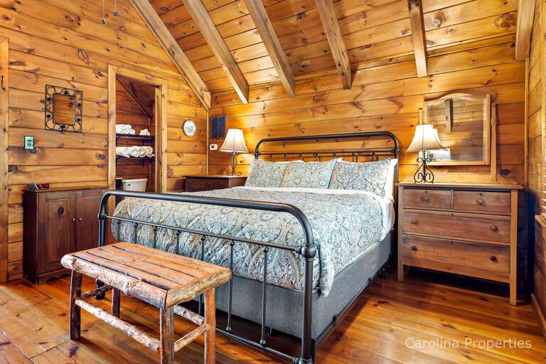 Lamps on either side of the bed for extra lighting and dressers for your use