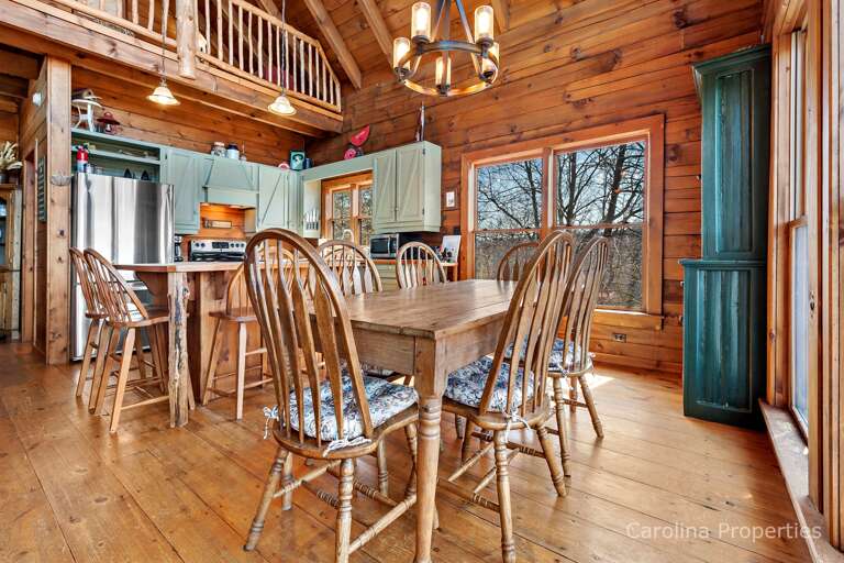 Just beyond the living area is the dining table that seats 6