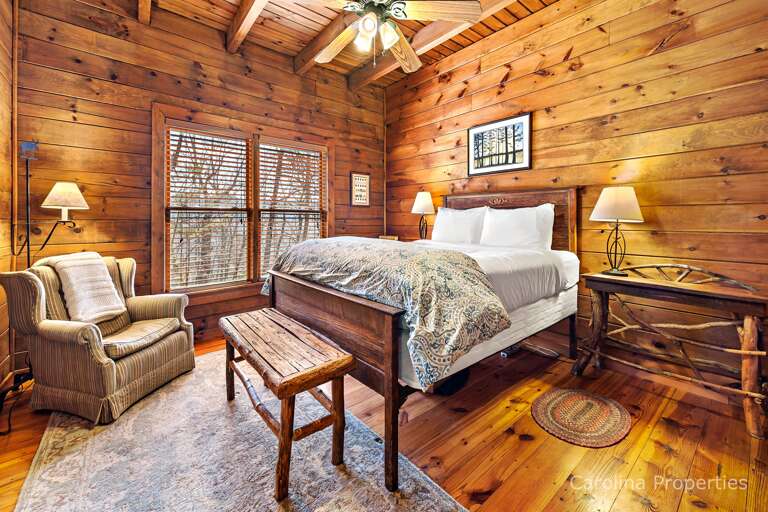 Main level bedroom 1 with a queen bed