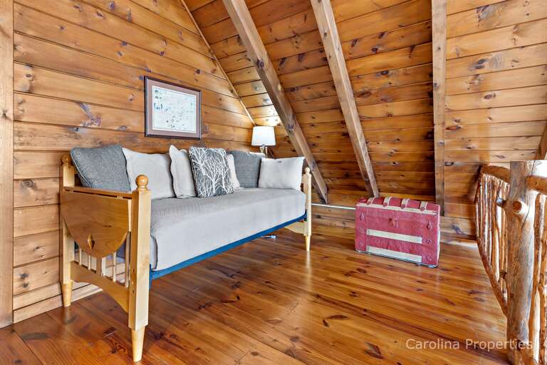 Loft day bed facing the wall of windows