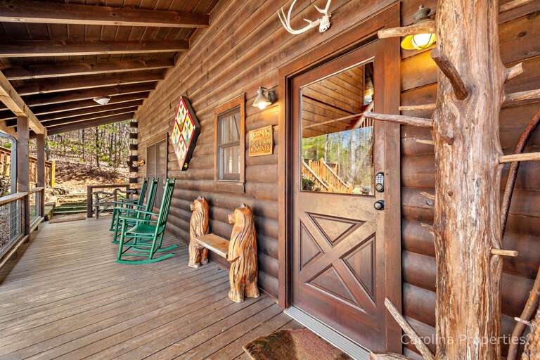 The covered front porch has a rocking chair and unique bench