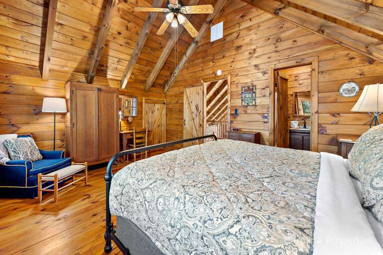 Ceiling fan with light, wardrobe and a desk area in this room