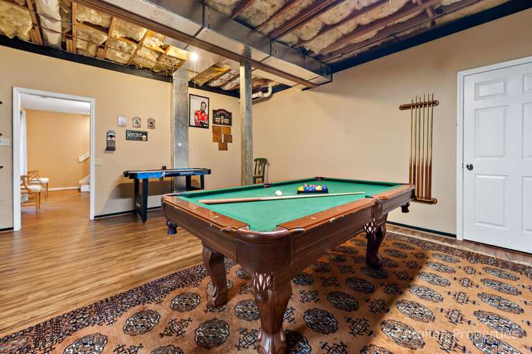 Downstairs the game room has a pool table and more