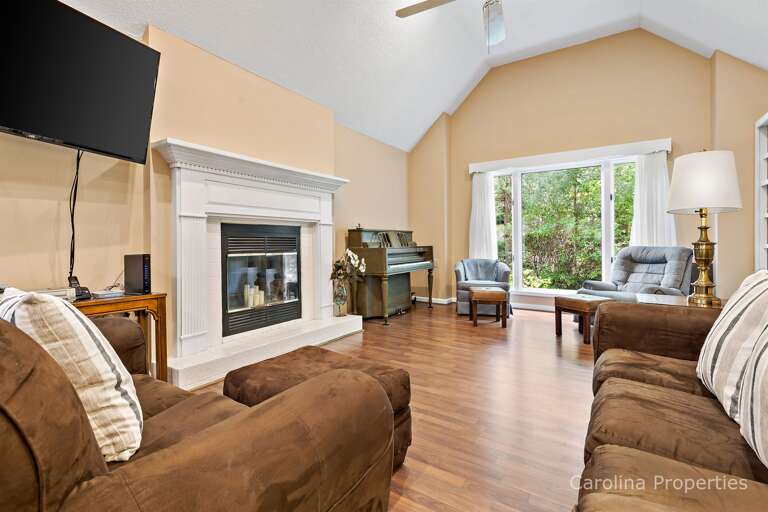 The large TV is adjustable and can be moved to face the kitchen