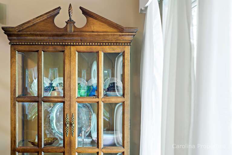 Cabinet beautifully displays antique dishes