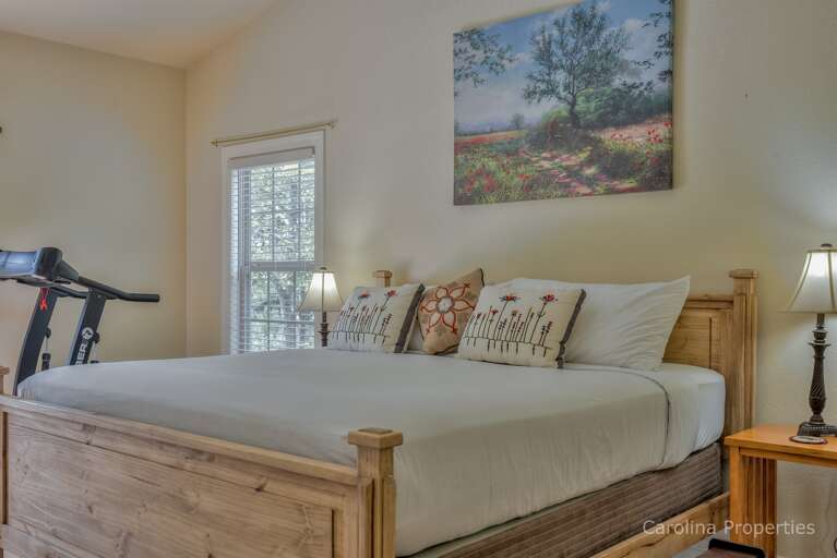 Main level master bedroom with king size bed