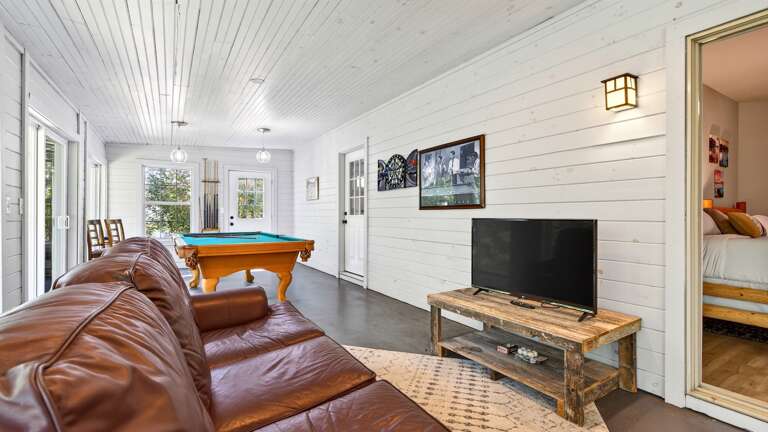 Game room features a TV.