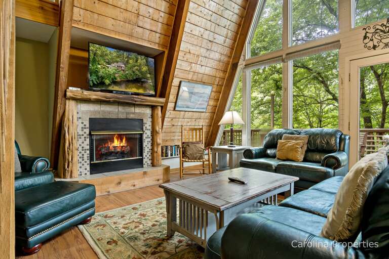 The stone fireplace and wall of windows are the focal point of this area.